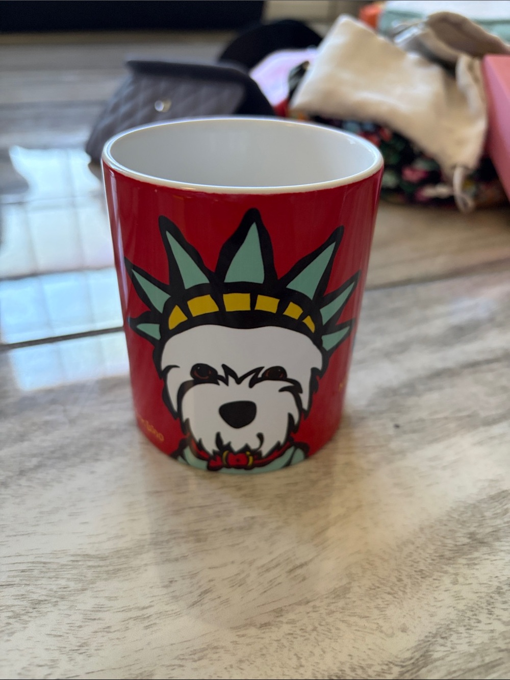 Red Ceramic Mug with Playful Dog Statue of Liberty Artwork
